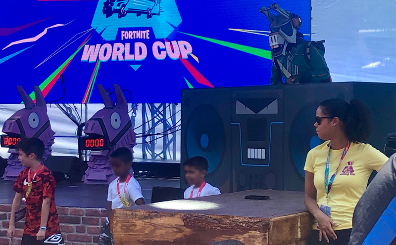Kids dance during a music set of in-game skin DJ Yonder